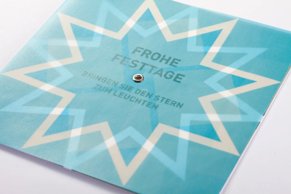 druckdesign_Tanner_Weihnachtskarte_mit_Stern-Drehelement_Kalaidos_Fachhochschule_001
