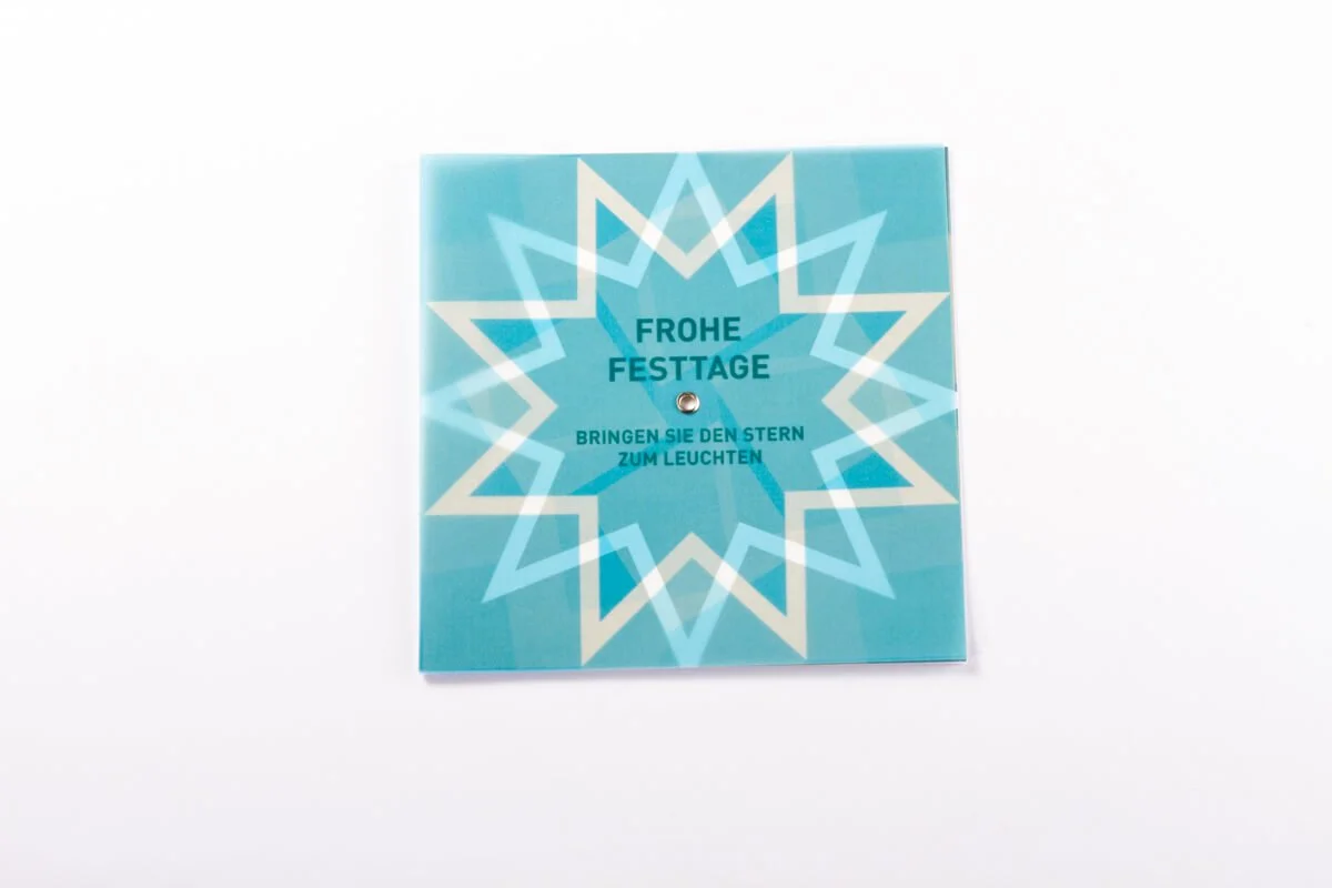 druckdesign_Tanner_Weihnachtskarte_mit_Stern-Drehelement_Kalaidos_Fachhochschule_002